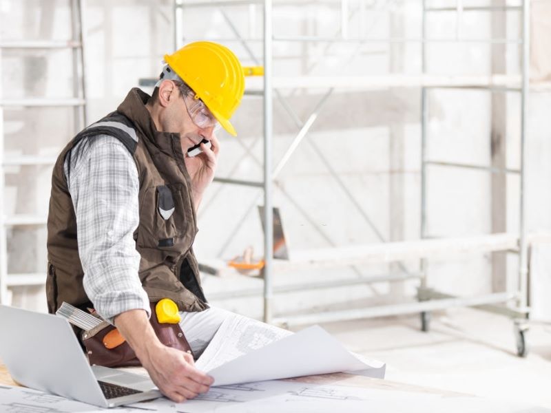 worker holding the paper